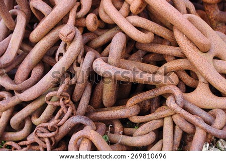 Closeup on Pile of Industrial Rusty Chain Background Texture
