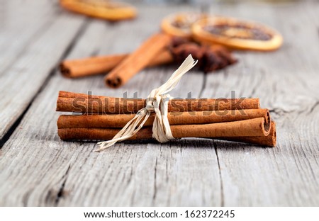 Cinnamon sticks, close up on wooden table