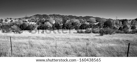 The Huachuca Mountains rise above the grasslands of southern Arizona\'s San Rafael Valley.