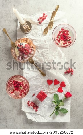 Image, Stock Photo Cocktail glasses mit Champagne , cake and many red heart with rose flowers. Top view. Romantic breakfast