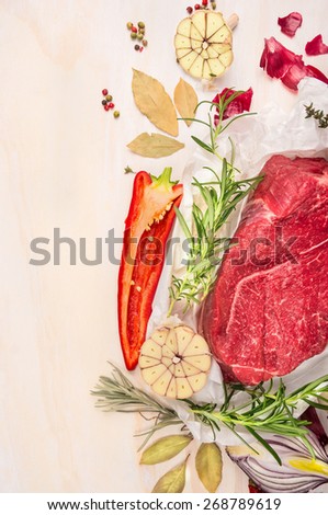 Raw meat with herbs and spices for cooking on white wooden background, top view, frame