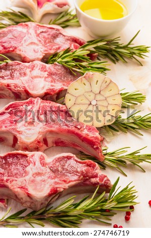 Raw fresh lamb loin chops with herbs and spices, preparation , close up