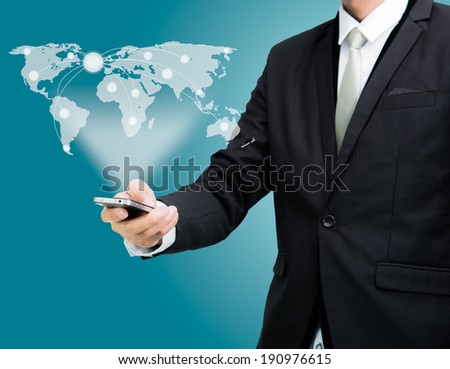 Businessman standing posture hand hold mobile phone Global Marketing isolated on blue background
