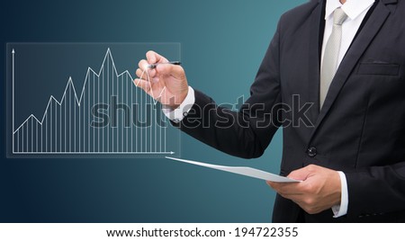 Businessman standing posture hand hold a pen isolated on dark background