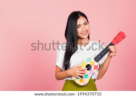 Similar – Image, Stock Photo young woman playing ukulele