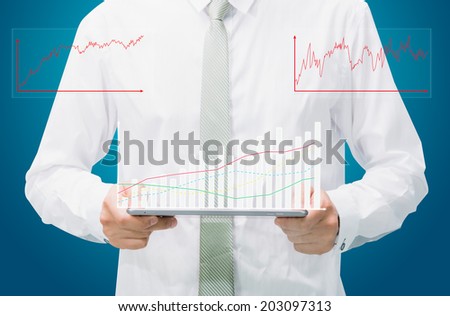 Businessman standing posture hand graph on tablet isolated on blue background