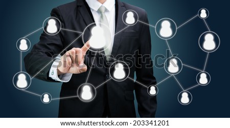 Businessman standing posture hand touching technology concept on dark background