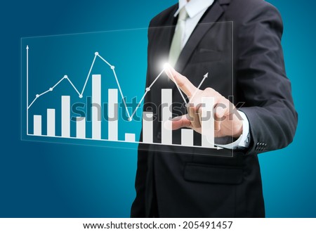Businessman standing posture hand touch graph finance isolated on over blue background