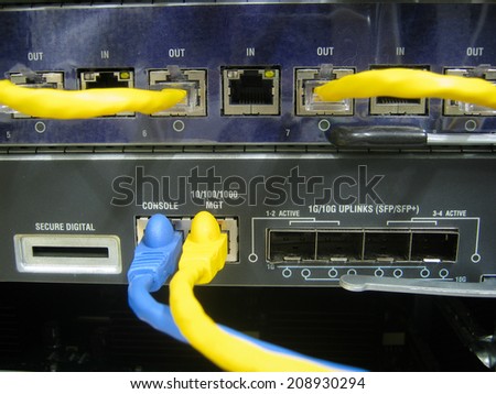 Console cable communications switch equipment installed chassis in large data center.