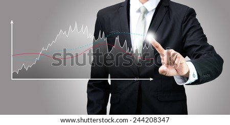 Businessman standing posture hand touch graph finance isolated on gray background