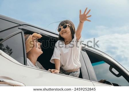 Image, Stock Photo Man sits in car and looks seriously out the window