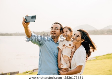 Similar – Image, Stock Photo Asian female taking selfie in underground passage