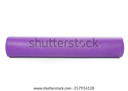 Close up purple yoga mat for exercise isolated on over white background