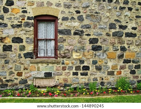Historical home with rock walls and flower garden. Grice House. Huron County Park. Harbor Beach, Michigan.