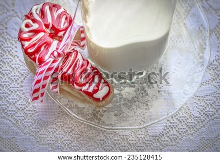 Christmas Cookies. Christmas cookies and milk set out for Santa tied with a ribbon and a bow.