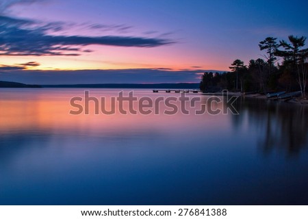 Lake Superior Dawn. Sunrise reflections along the shores of a calm Lake Superior.