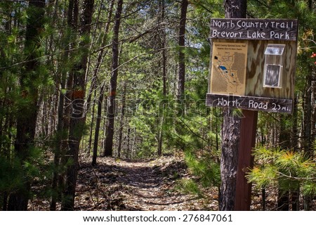 Brevoort Lake, Michigan. USA. May 7, 2015.  North Country Trail map and mileage marker. The North Country Trail is approximately 4600 miles long and traverses America\'s rugged northern wilderness.