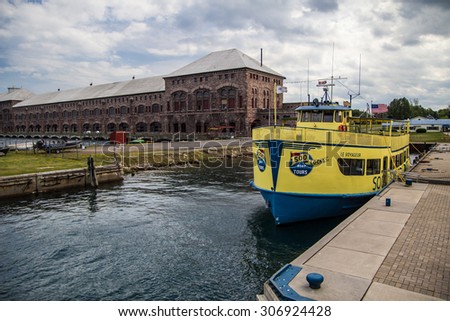 Sault Ste. Marie, Michigan, USA - August 9, 2015. The Soo Locks Boat Tour takes visitors through the American and Canadian Soo Locks. The locks are one of the busiest shipping channels in the world.