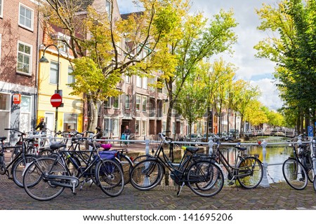 DELFT, NETHERLANDS - SEPTEMBER 27. Parking of bicycles on the bank of the channel in Delft, Nideranda, September 27, 2012. The population as of January 1, 2008 made 96 168 people