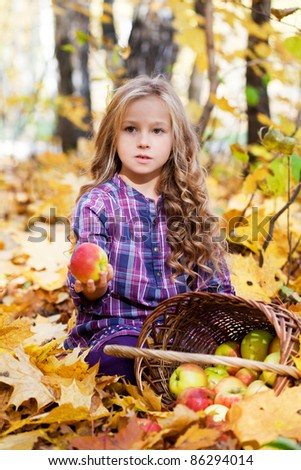 beautiful little girl on walk in autumn park