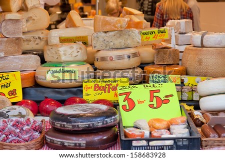 DELFT,NETHERLANDS - SEPTEMBER 27: Show-window with cheese in shop, Delft, Holland, September 27,2012. The volume of export of Dutch cheese makes 7 billion euro a year
