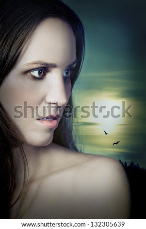 Beautiful vampire girl under the moon in profile looking to the side. Novel cover look.
