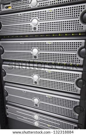 Servers and SAN. This enclosure is a SAN (storage area network). Shot in a data center. Hard drives.