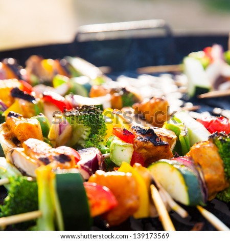 Fresh and delicious barbecue with skewers with vegetables.