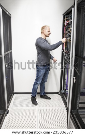 IT engineer connecting network in datacenter