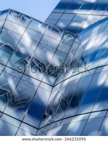 Abstract glass architectural fragment in blue for background or texture.