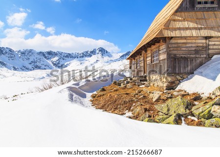 Wooden house in mountains in winter scenery, Tatras Mountains, Poland