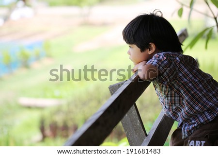 a boy in loneliness mood. He\'s waiting for someone come visit him