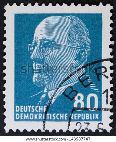 GERMAN DEMOCRATIC REPUBLIC - CIRCA 1961: A stamp printed in Germany shows the leader of East Germany from 1950 to 1971 Walter Ulbricht, circa 1961.  vV Vintage stamp isolated on black