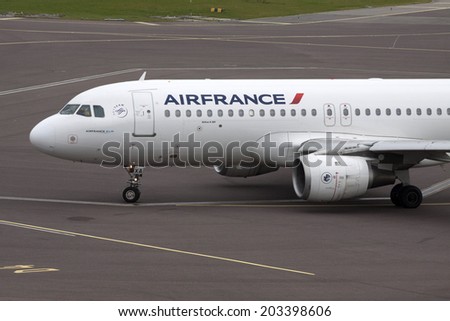 AMSTERDAM,HOLLAND - FEBRUARY 23, 2014: Front of a just arrived white air france passenger plane on shiphol airport february 23 , 2014 in Amsterdam, The Netherland.