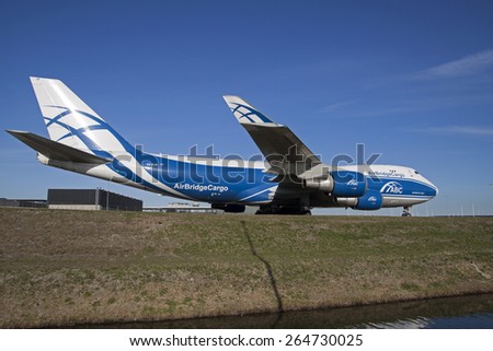 AMSTERDAM, THE NETHERLANDS - FEBRUARY 18, 2015: Just landed Boeing 747 from Air Bridge Cargo taxiing  on the way to his place at the gate on february 18 , 2015 in Amsterdam, Holland.