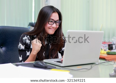 Business people use computer notebook Having Meeting Around Table In Modern Office