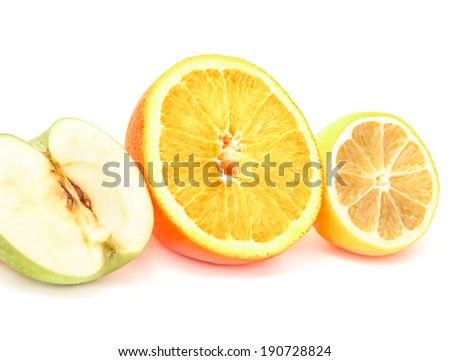 three slices of big orange, apple, and lemon isolated on white