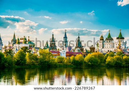 Beautiful landscape with Izmaylovo Kremlin behind river and lush greenery, Moscow, Russia