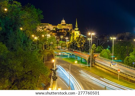Buda Castle by the Danube river illuminated at night in Budapest, Hungary
