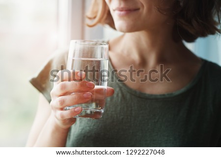 healthy beautiful young woman holding glass of water  Foto d'archivio © 
