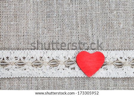 wooden hearts and vintage ribbon on linen cloth