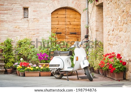 Similar – Image, Stock Photo Classic green Vespa Scooter parked in the sidewalk.