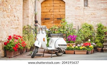 Similar – Image, Stock Photo Classic green Vespa Scooter parked in the sidewalk.