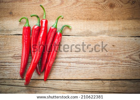 Juicy and spicy peppers on a wooden rustic table