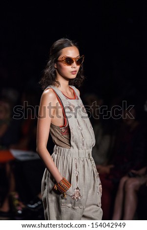 NEW YORK, NY - SEPTEMBER 11: A model walks the runway at the Anna Sui Spring Summer 2014 fashion show during Mercedes-Benz Fashion Week on September 11, 2013 in New York City, USA.