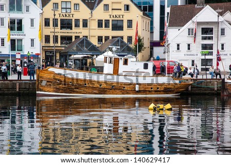 STAVANGER, NORWAY - AUGUST 11: Guest harbour with old-style houses on August 11, 2012 in Stavanger, Norway. Stavanger is Norway\'s fourth largest city, and is called the petroleum Capital of Norway.