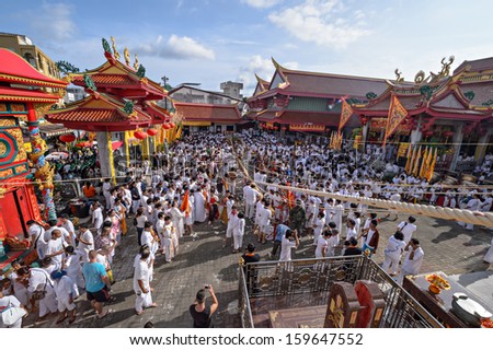 PHUKET - OCTOBER 14: an unidentified People a Perform a ceremony Set The sacred wood poles is the symbol of the beginning Phuket Vegetarian Festival October 14, 2012 in Phuket Province, Thailand.