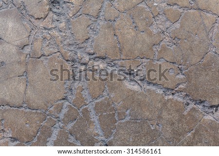 Grunge textured concrete sidewalk with cracks