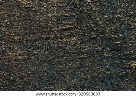 Artistic style dark gold and black painted on concrete wall for design, website, wallpaper, background