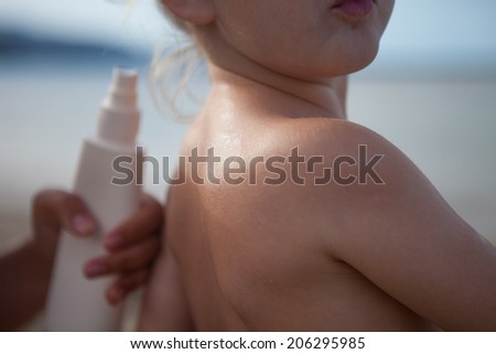 baby and sunscreen cream